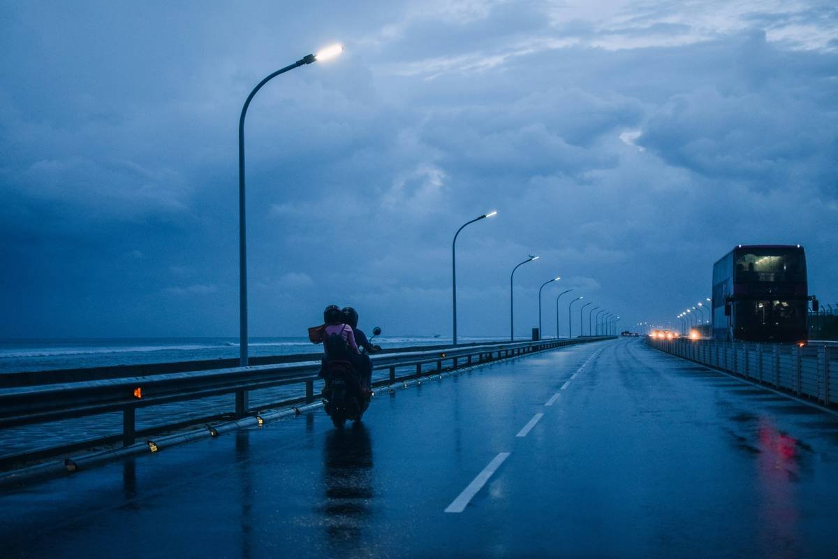 Infographic showing common weather-related motorcycle damages: hail dents (42%), water submersion (31%), lightning strikes (7%), UV cracking (12%), sand abrasion (8%) - based on 2023 Global Motorcycle Rental Claims Data