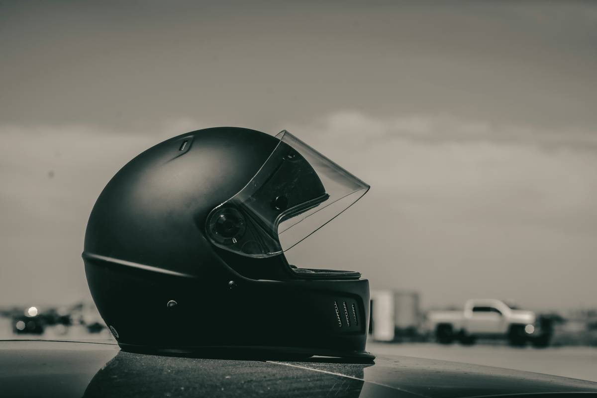 Biker reviewing bike shield motorcycle cover documents before signing rental agreement